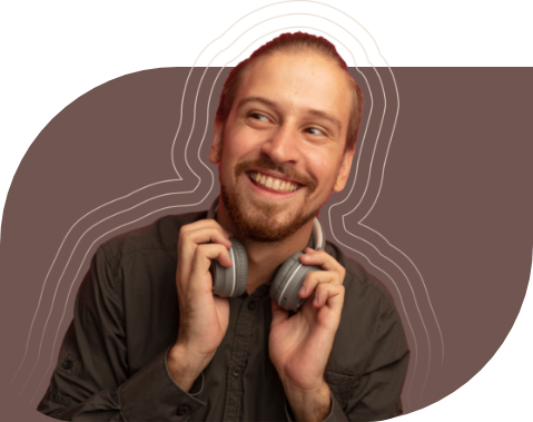 Smiling man holding headphones around his neck with artistic graphic lines in the background